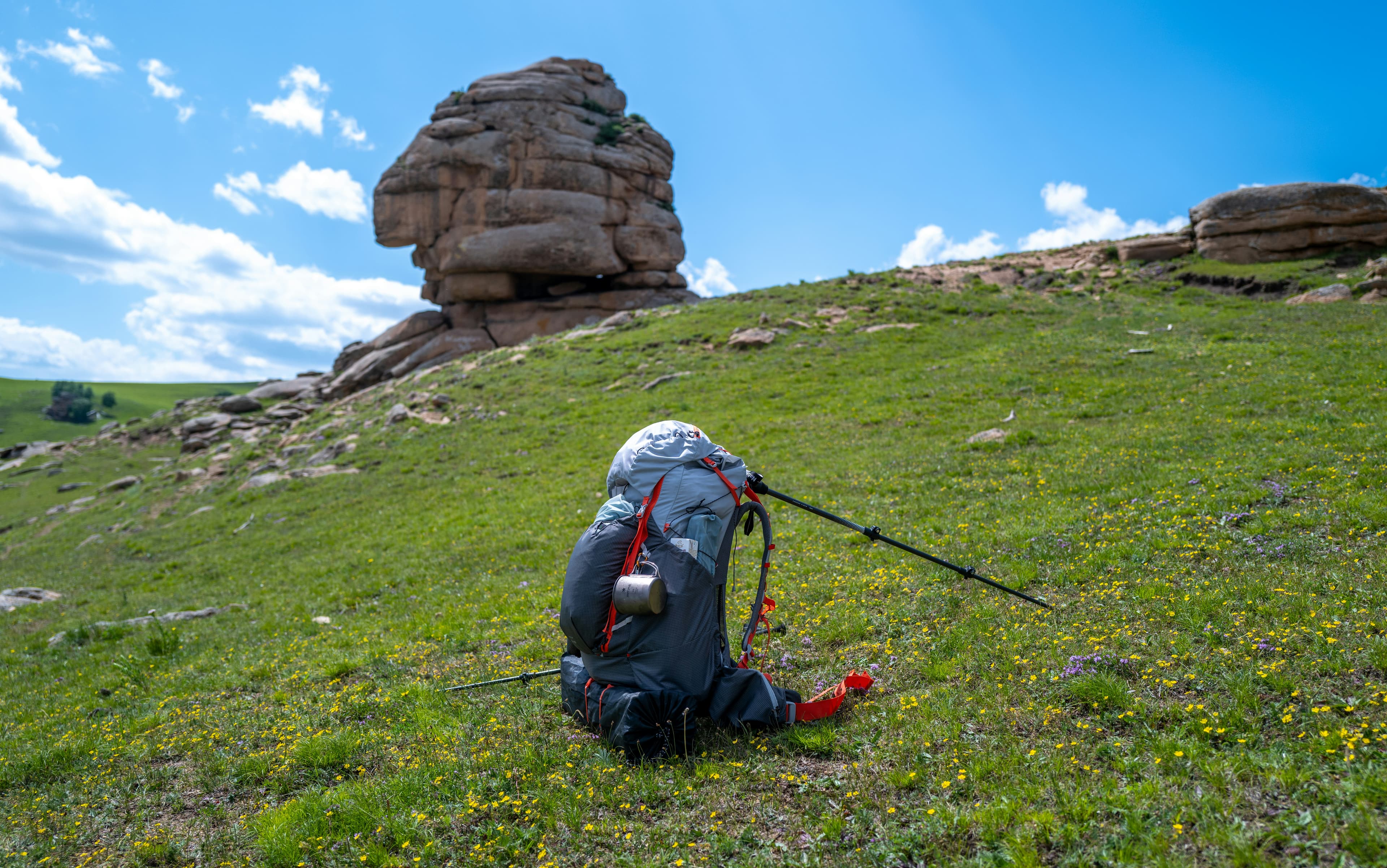 Hiker with ultralight backpack on mountain ridge