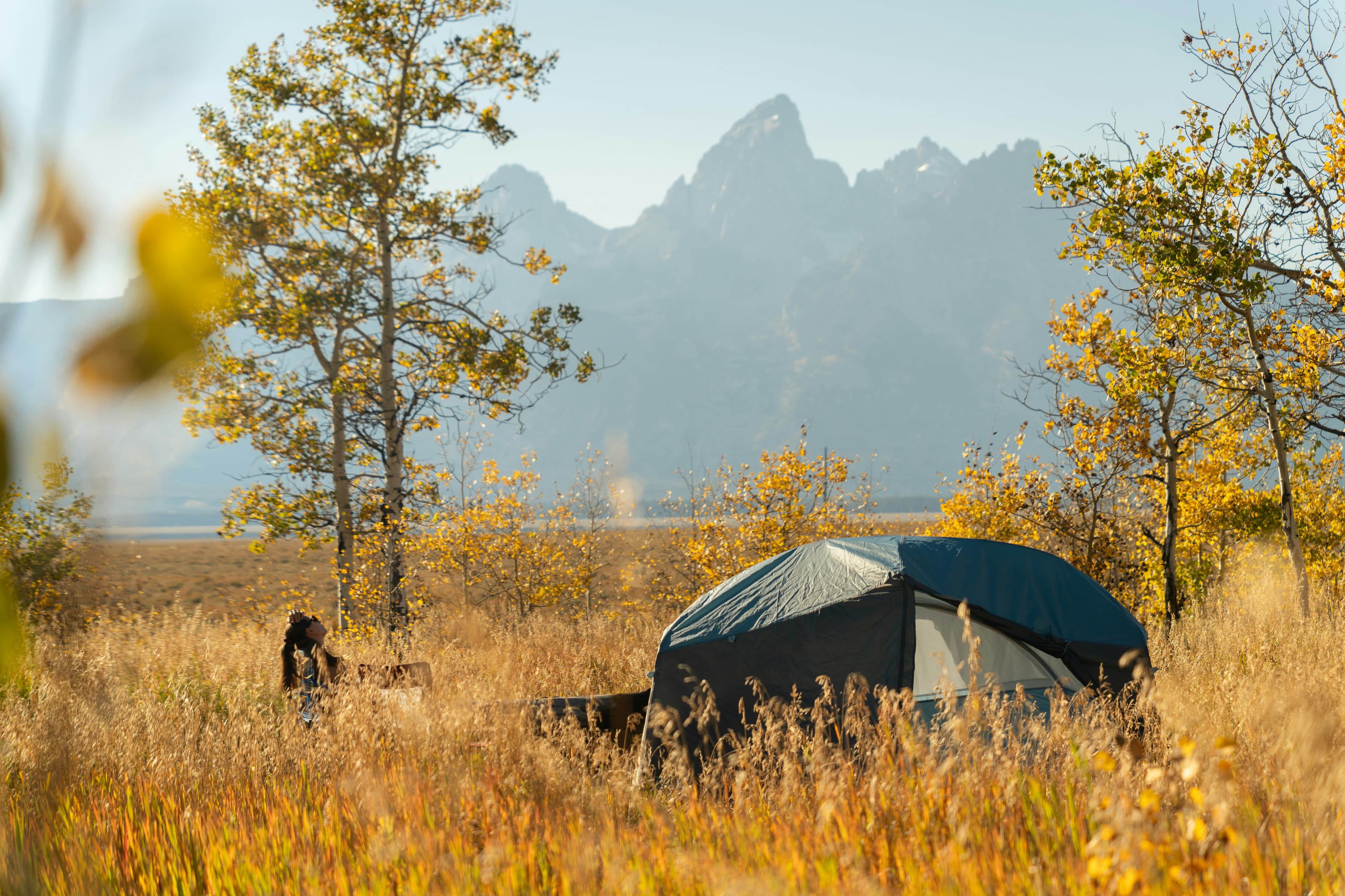 Tent pitched at a campsite in the mountains